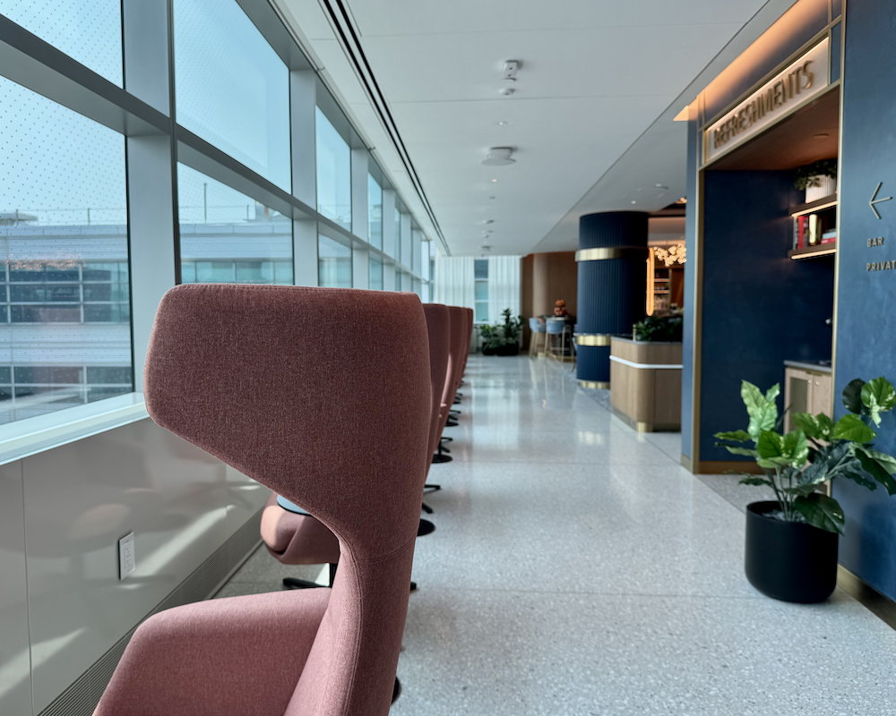 Capital One Lounge at JFK seating along a hallway.