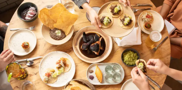 A photo of a table with food at a restaurant