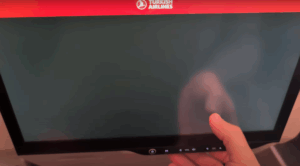Screengrab from a video showing the author tapping a black Turkish Airlines in-flight entertainment screen