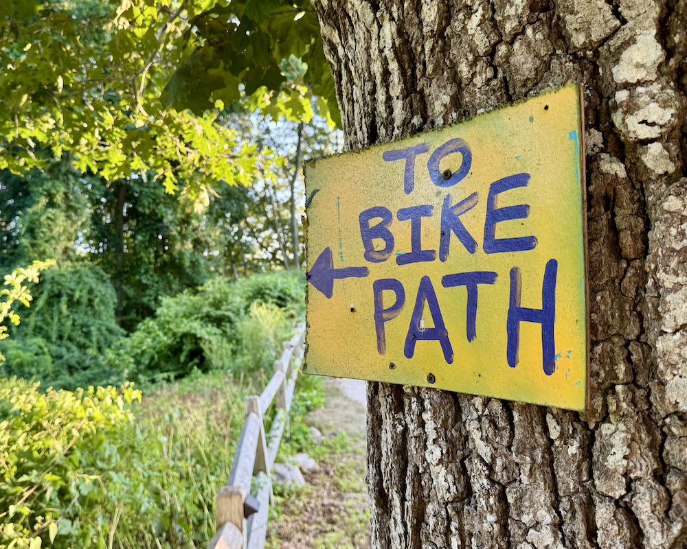 AutoCamp Cape Cod bike path sign.