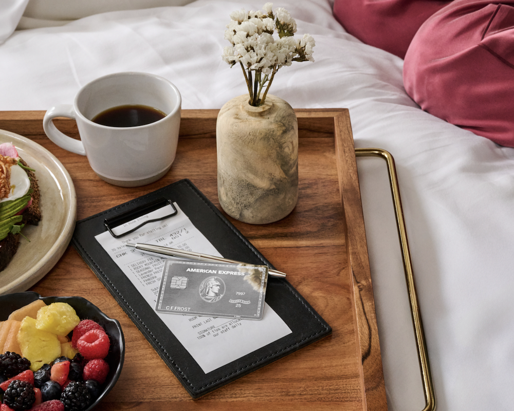American Express Platinum Card on a hotel room service tray.