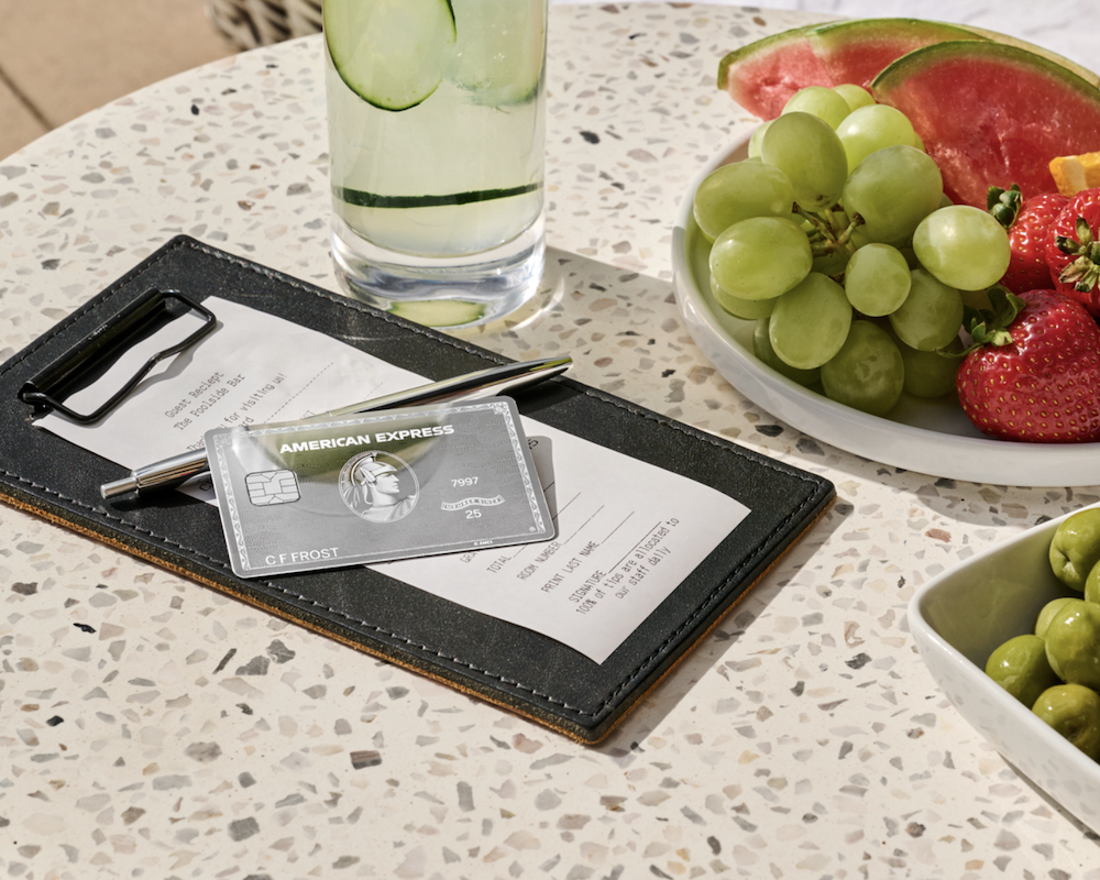 American Express Platinum Card on a restaurant bill folio.