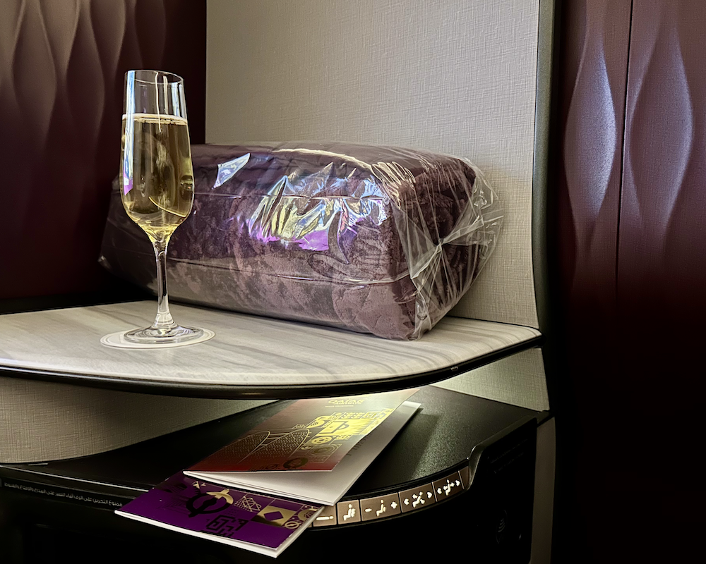 Qatar Airways Qsuite blanket, champagne.