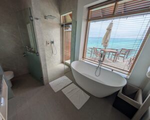 Bathroom in an overwater villa at Baros Maldives