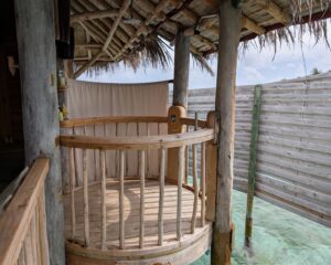 Outdoor shower in an overwater villa at Six Senses Laamu in the Maldives