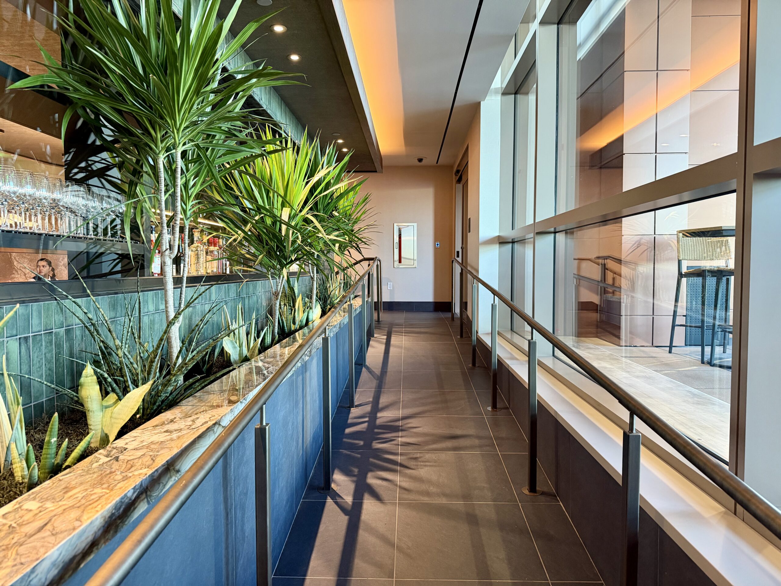 Amex Centurion Lounge SLC foliage and hallway.