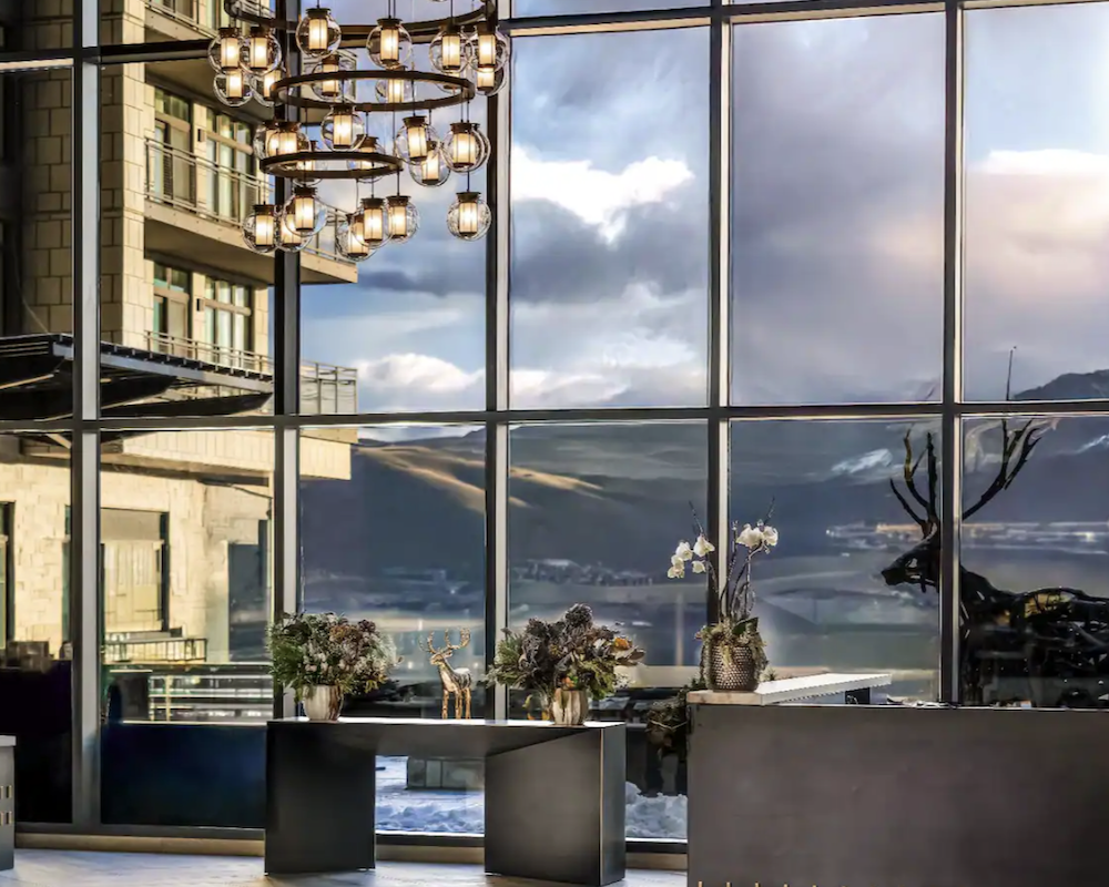 Grand Hyatt Deer Valley lobby with mountain backdrop.