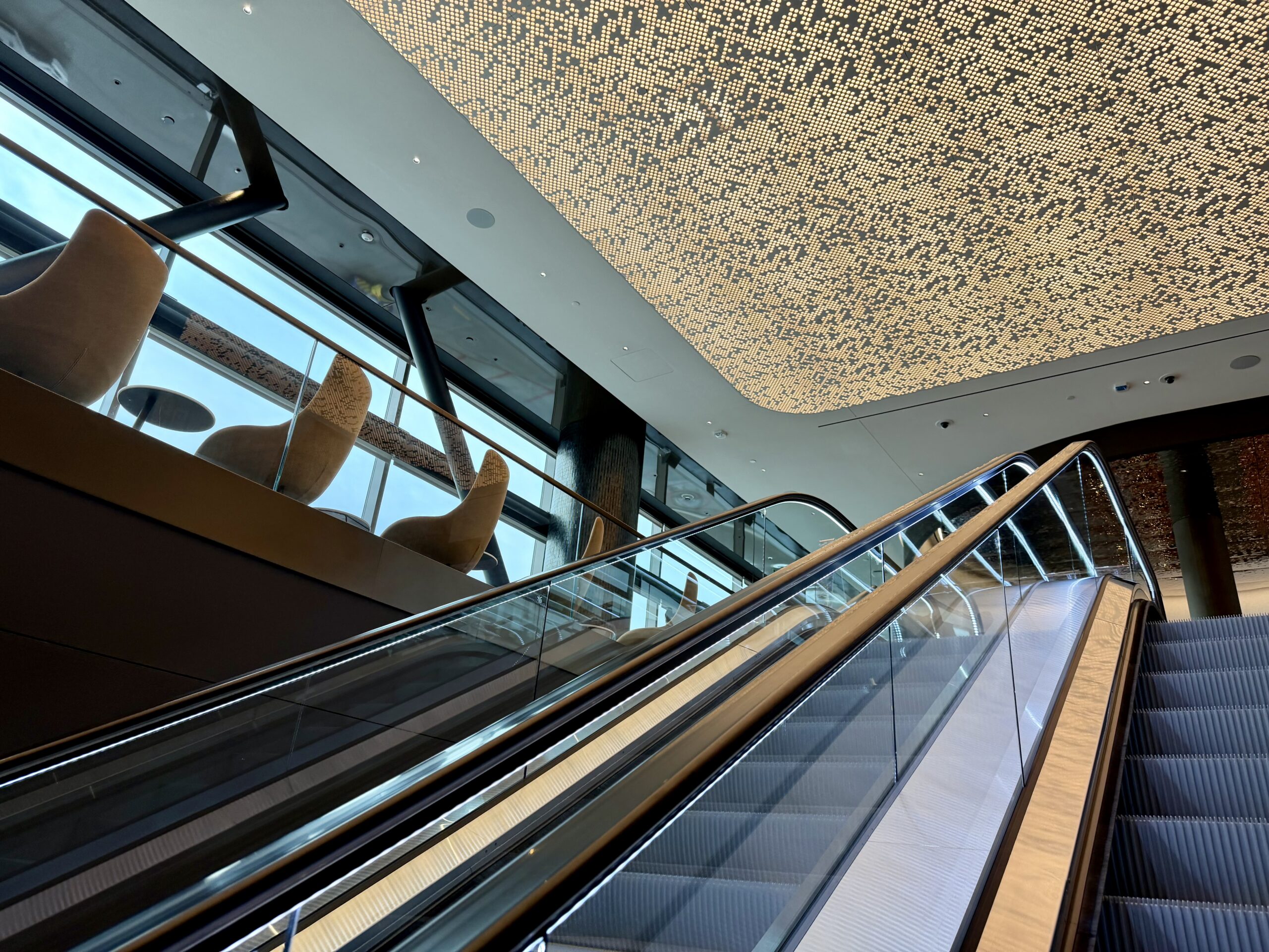Delta Sky Club SLC Concourse B escalator and artwork.