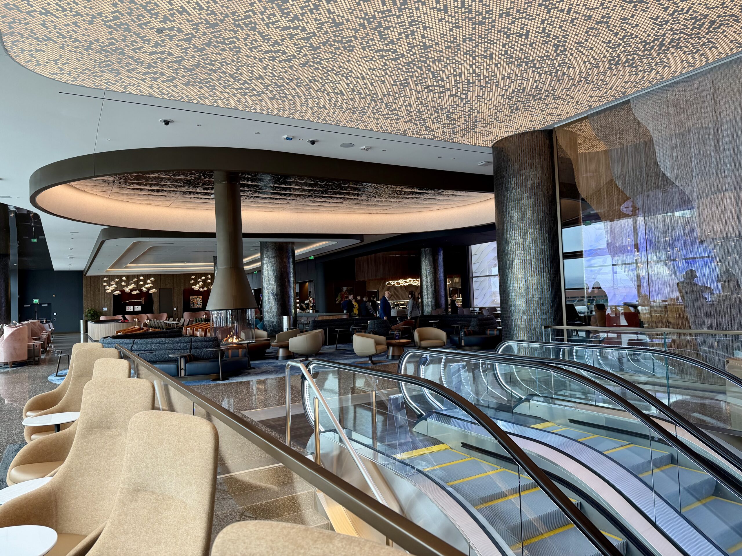 Delta Sky Club SLC Concourse B escalators and central artwork.