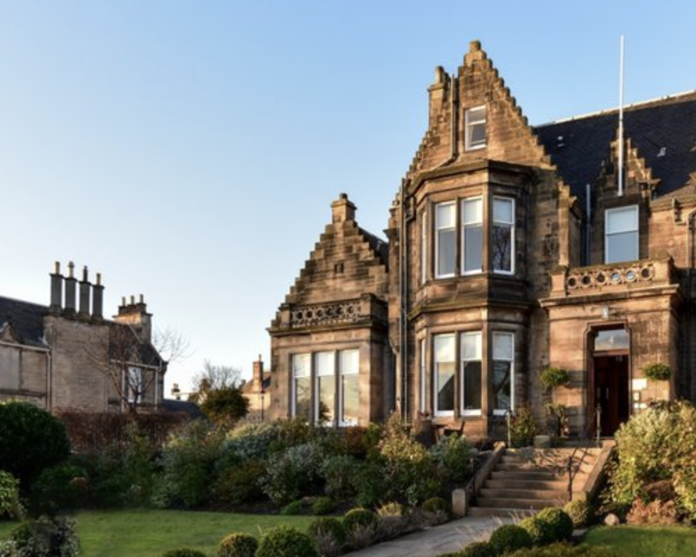 The The Roseate Edinburgh, an SLH Hotel at dusk.