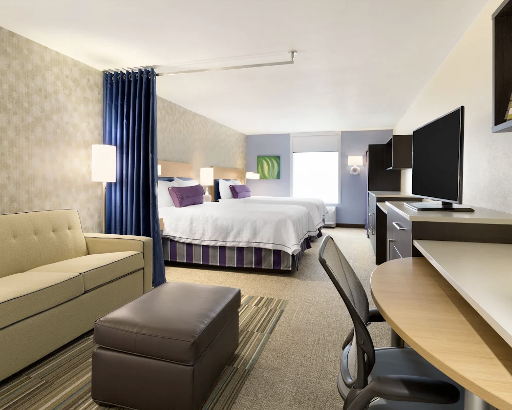 Bedroom at the Home2 Suites by Hilton Houston Willowbrook.