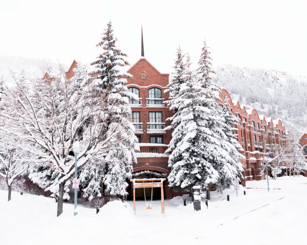 Snow-covered exterior of The St. Regis Aspen Resort.
