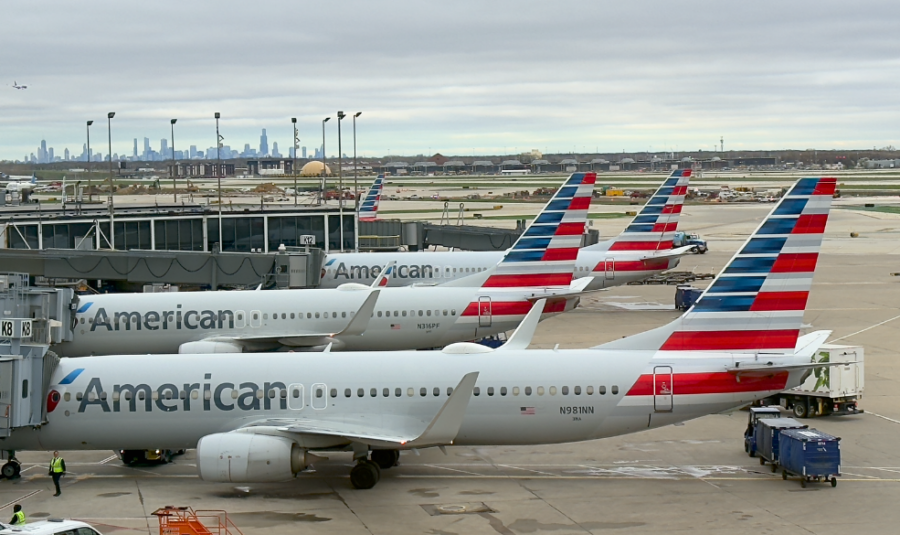 American Airlines aircraft parked at Terminal 3 Concourse K at Chicago-O'Hare International Airport with the Chicago skyline in the background