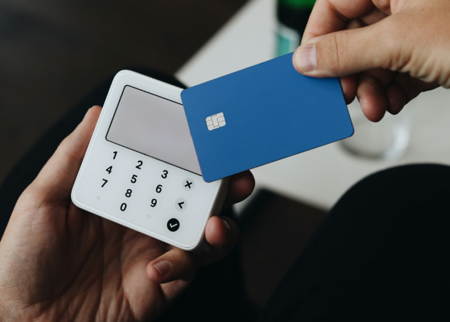 A person using an unbranded contactless credit card