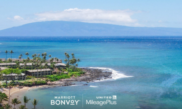 A photo of a tropical island with the logos for Mariott and United Airlines