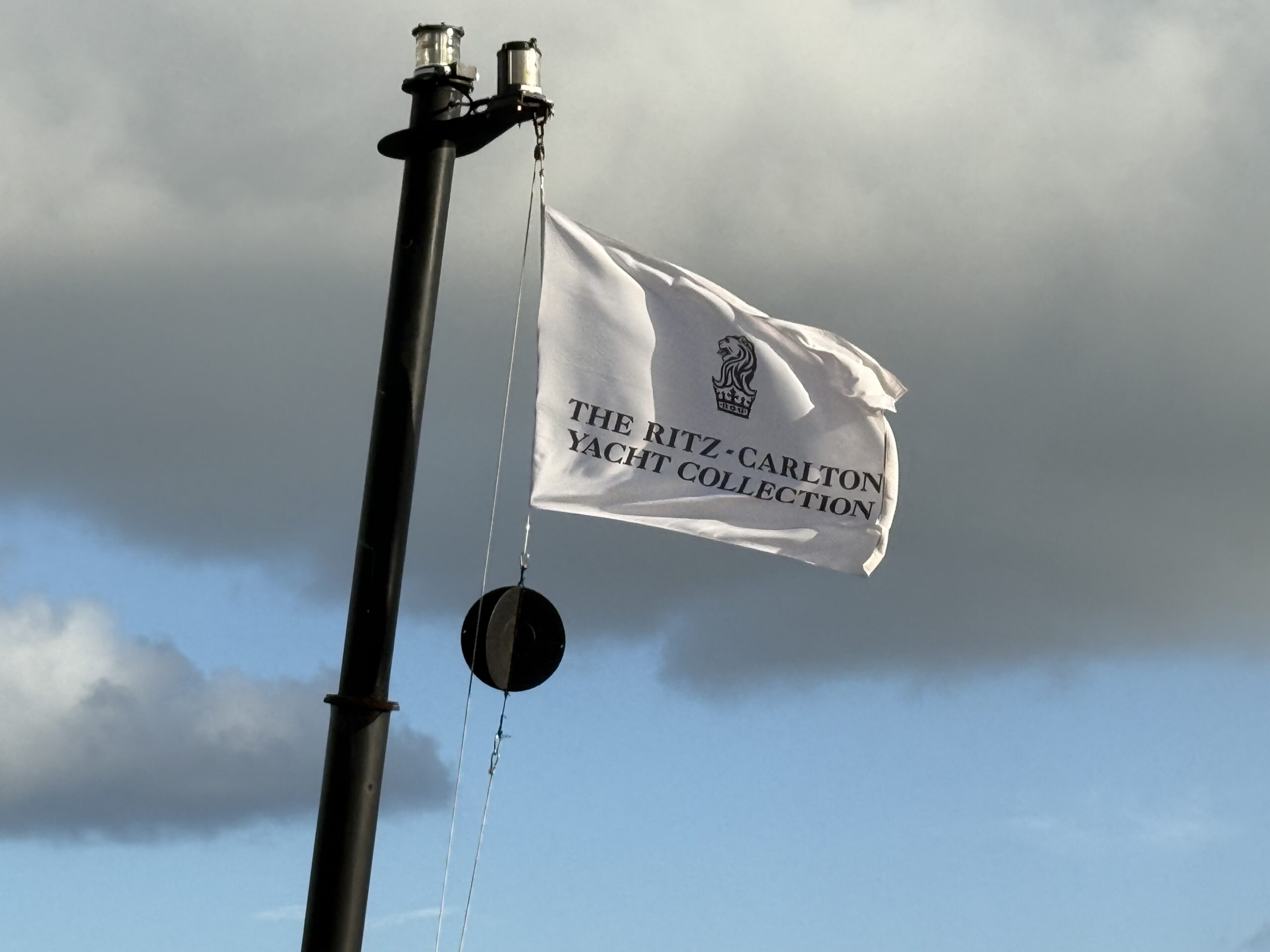 White ritz carlton evrima flag at mast