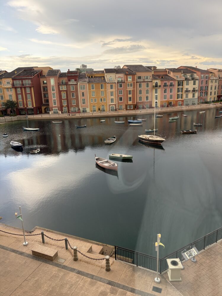 Loews Portofino Bay Hotel view with water front and smal boats scattered around.