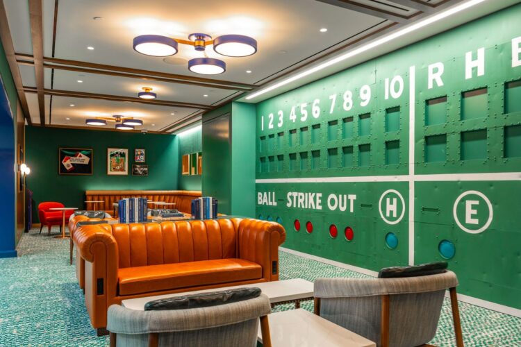 JetBlue's BlueHouse Lounge in Boston with a wall resembling Fenway Park's Green Monster