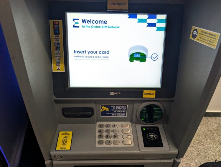 Photo of an ATM with a lit-up card reader pad