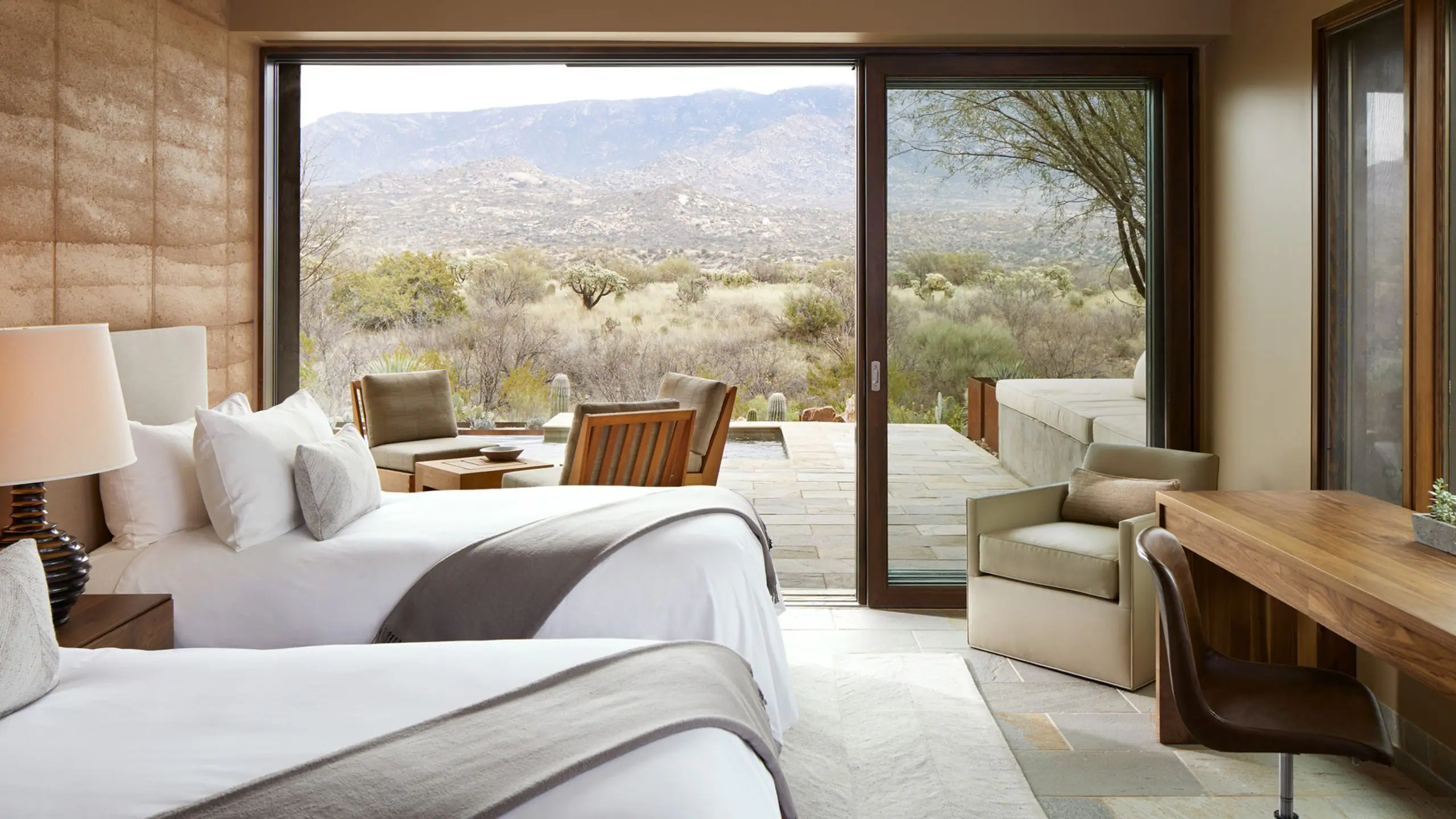 Room at the Miraval Arizona Resort and spa with two beds overlooking nature